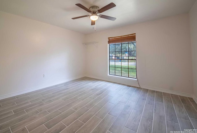 empty room featuring ceiling fan and light hardwood / wood-style floors