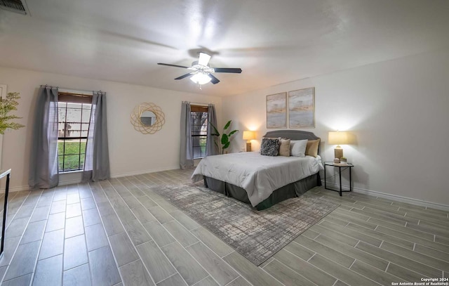 bedroom featuring ceiling fan and light hardwood / wood-style floors