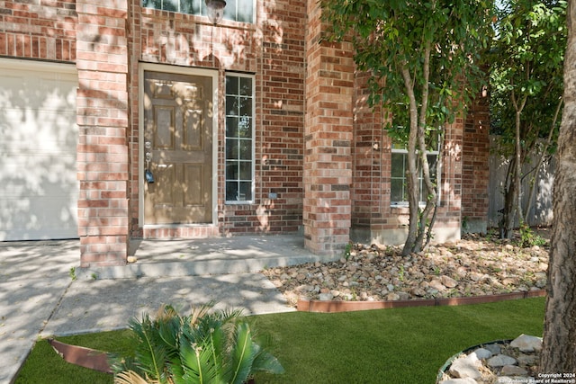 entrance to property featuring a garage