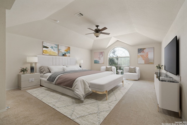 carpeted bedroom with vaulted ceiling and ceiling fan