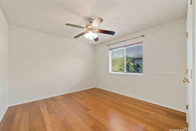 unfurnished room featuring light hardwood / wood-style floors and ceiling fan