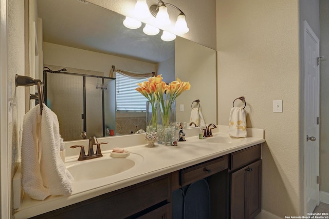 bathroom with vanity and walk in shower