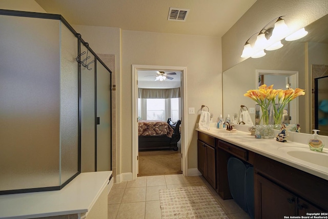 bathroom featuring tile patterned flooring, vanity, ceiling fan, and a shower with shower door