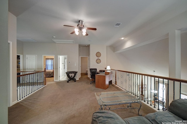 interior space featuring ceiling fan and light colored carpet