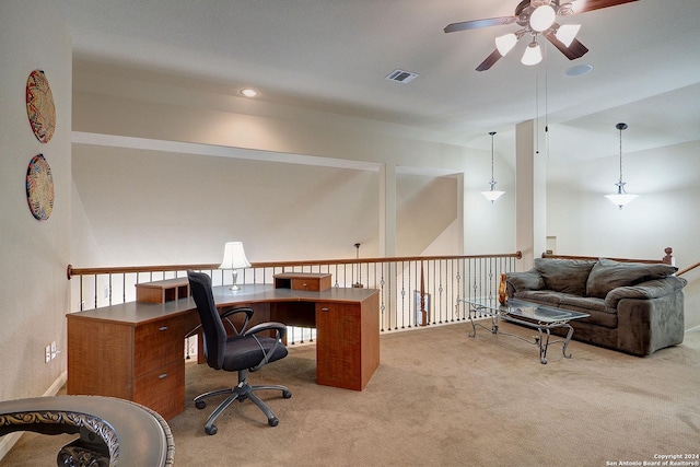 home office with ceiling fan and light carpet