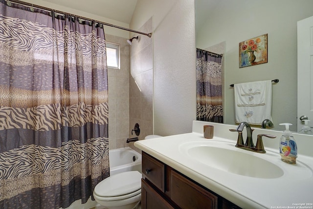 full bathroom with shower / bath combo, vanity, toilet, and lofted ceiling