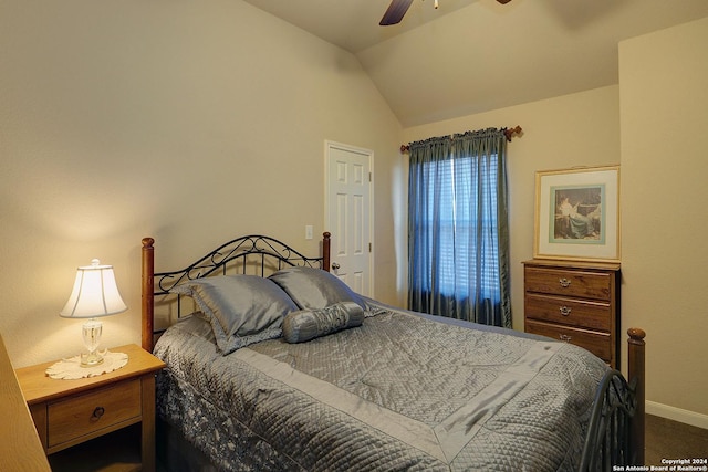 carpeted bedroom featuring ceiling fan and vaulted ceiling