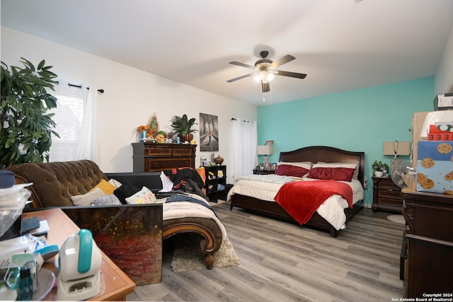 bedroom with hardwood / wood-style flooring and ceiling fan