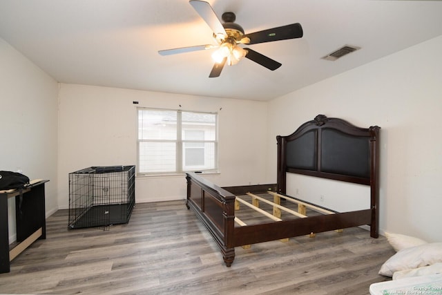 bedroom featuring hardwood / wood-style floors and ceiling fan