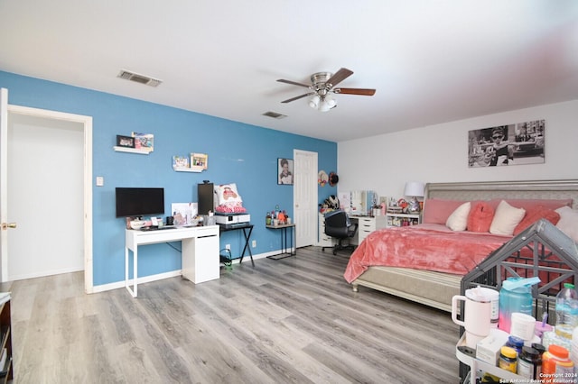 bedroom featuring hardwood / wood-style flooring and ceiling fan