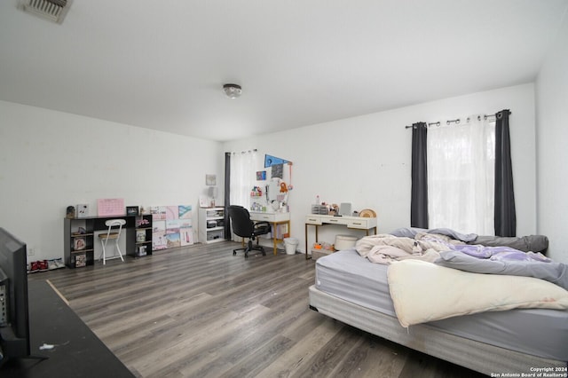 bedroom featuring wood-type flooring