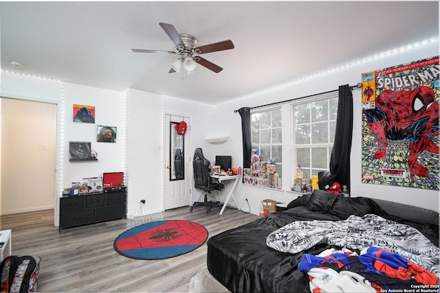 bedroom featuring hardwood / wood-style flooring and ceiling fan