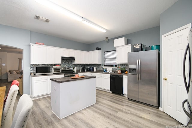 kitchen featuring a center island, white cabinetry, and appliances with stainless steel finishes