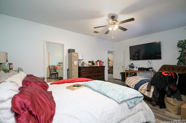 bedroom with ceiling fan and hardwood / wood-style floors