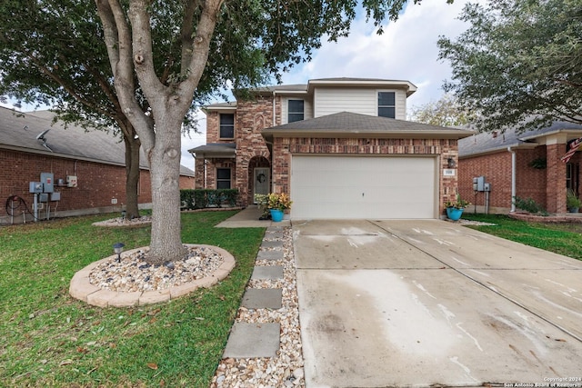 front of property with a front yard and a garage