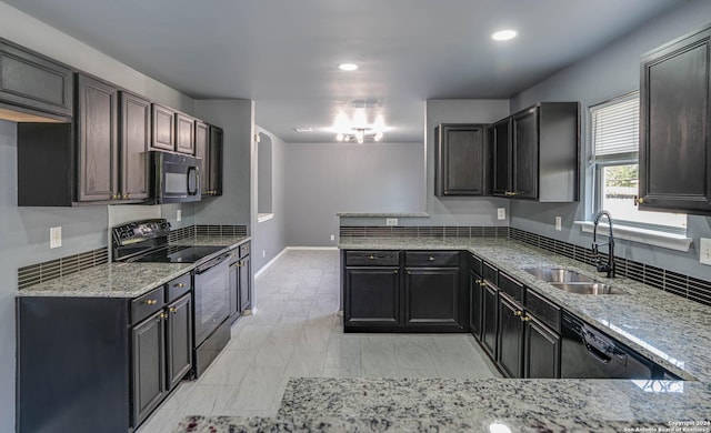 kitchen with black appliances, dark brown cabinets, light stone countertops, and sink