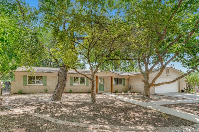 ranch-style house featuring a garage