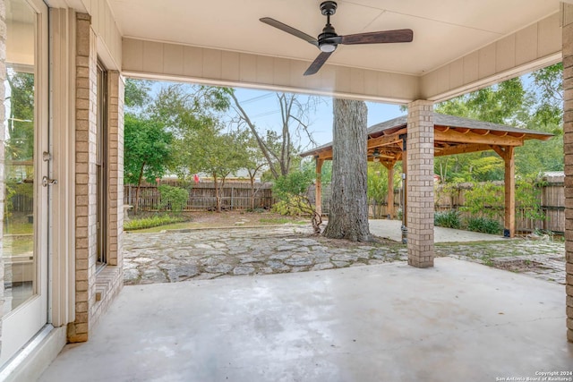 view of patio featuring ceiling fan