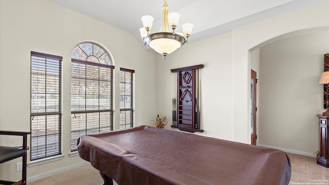 game room featuring light tile patterned flooring, a notable chandelier, and pool table