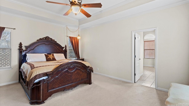 bedroom with crown molding, ceiling fan, and light colored carpet