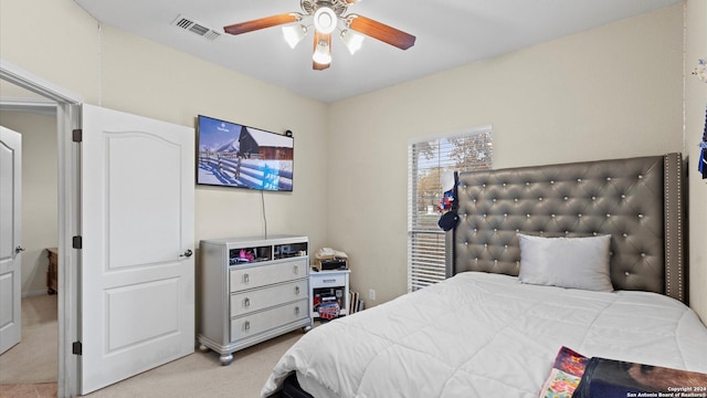 carpeted bedroom featuring ceiling fan