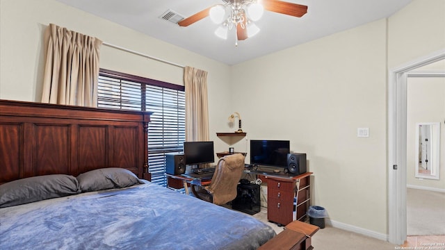 bedroom with ceiling fan and light carpet