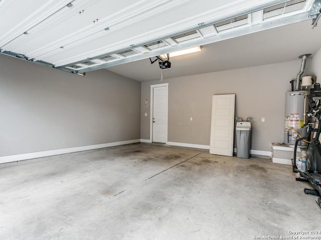 garage featuring a garage door opener and water heater