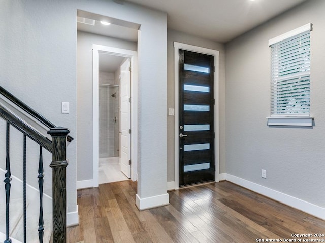 entryway with hardwood / wood-style flooring