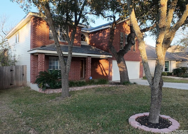 view of front of home featuring a garage and a front yard