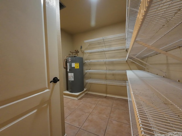 utility room featuring electric water heater