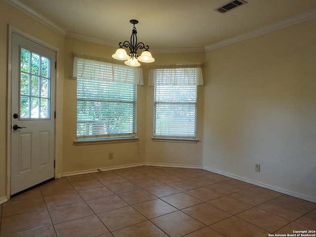 unfurnished dining area featuring ornamental molding, a notable chandelier, and light tile patterned flooring