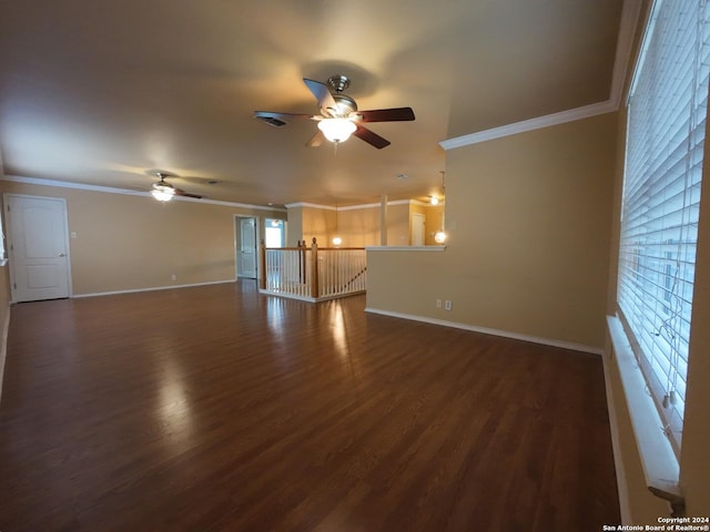 unfurnished living room featuring dark hardwood / wood-style flooring, ceiling fan, and ornamental molding