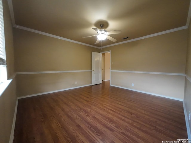 unfurnished room featuring dark hardwood / wood-style flooring, ceiling fan, and ornamental molding