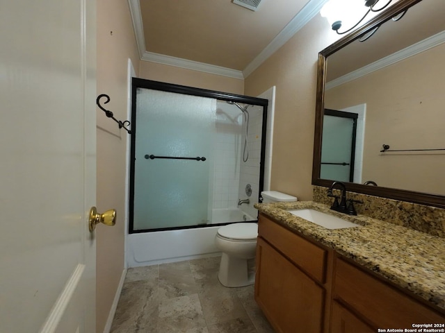 full bathroom with vanity, toilet, crown molding, and enclosed tub / shower combo