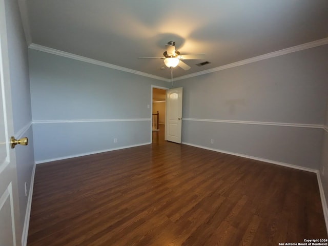 spare room with crown molding, dark hardwood / wood-style flooring, and ceiling fan