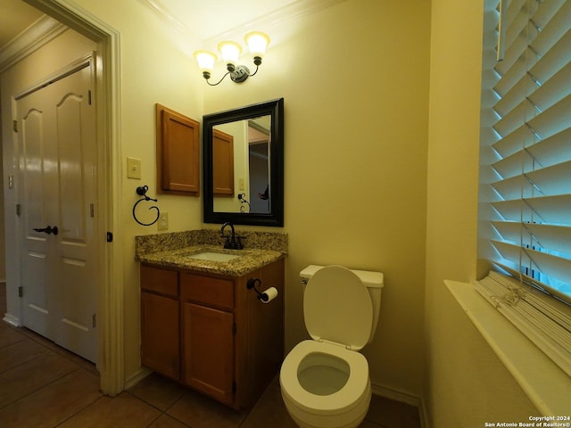 bathroom featuring tile patterned floors, vanity, toilet, and ornamental molding