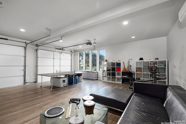 garage featuring a garage door opener and a wall mounted air conditioner