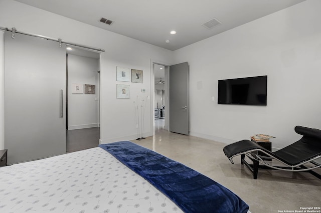 bedroom featuring concrete flooring