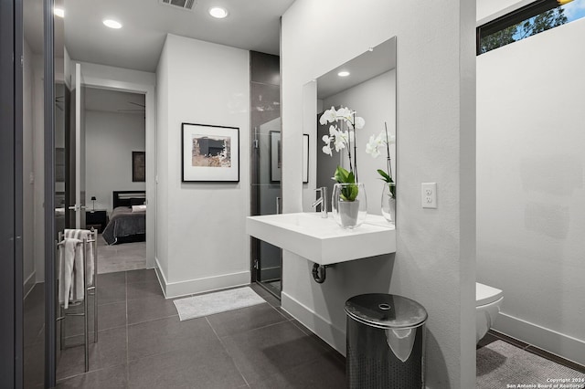 bathroom featuring tile patterned flooring and toilet