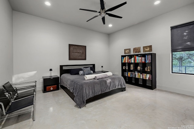 bedroom with concrete flooring and ceiling fan