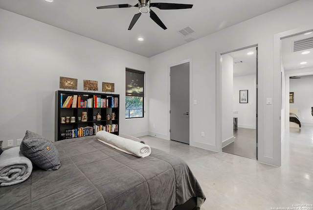 bedroom with ceiling fan and concrete floors