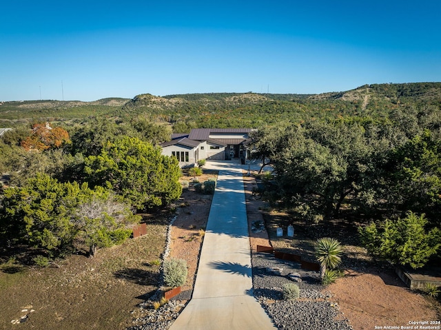 birds eye view of property featuring a mountain view