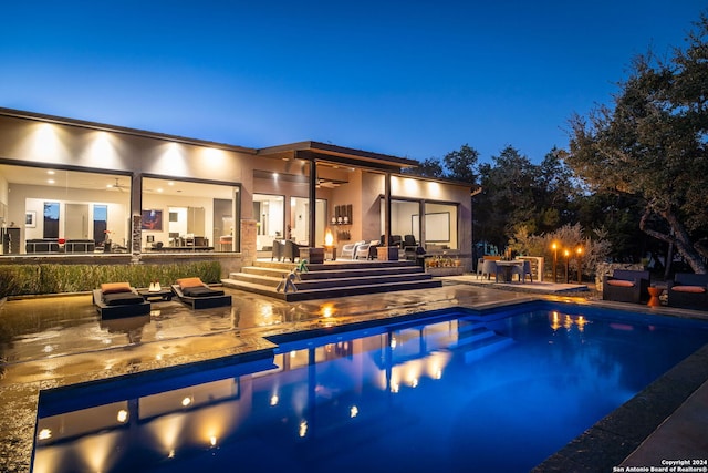 view of swimming pool with a patio area and ceiling fan