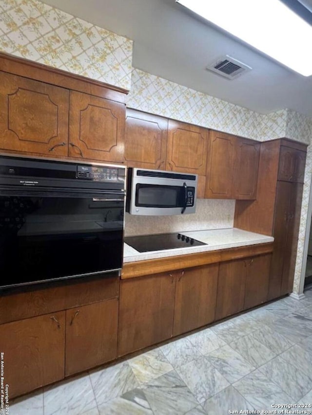 kitchen featuring black appliances