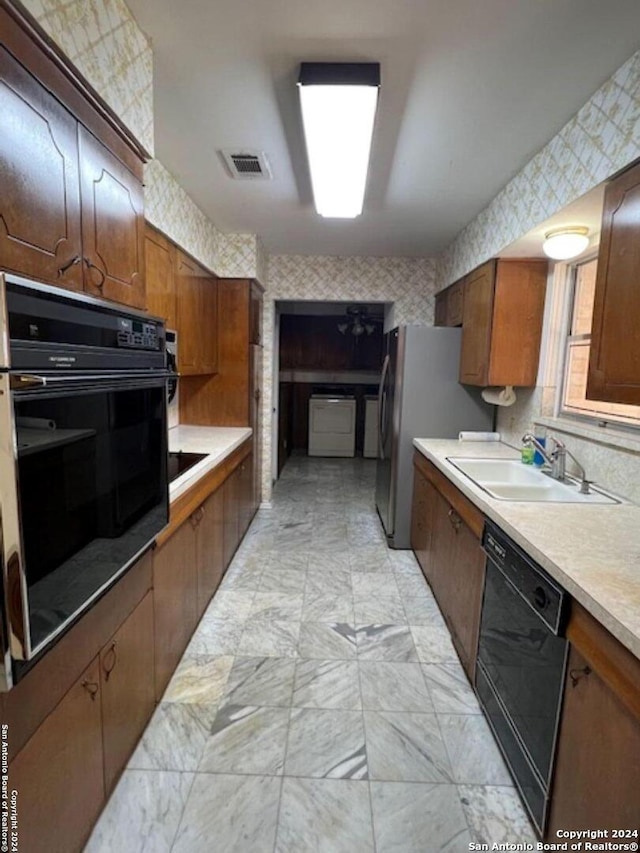 kitchen with sink and black appliances