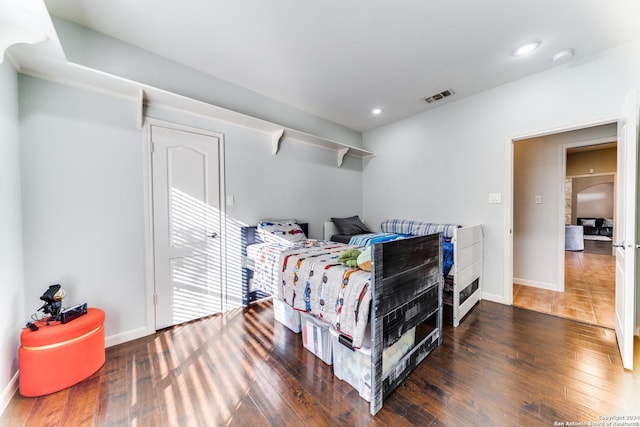 bedroom featuring dark wood-type flooring