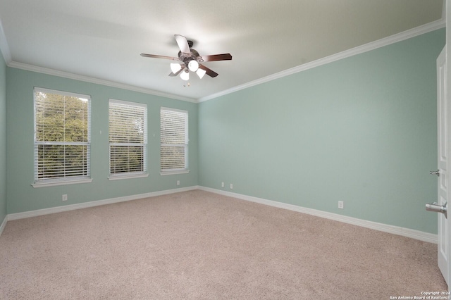 unfurnished room featuring light carpet, crown molding, and ceiling fan