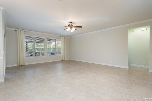 unfurnished room with ceiling fan and ornamental molding