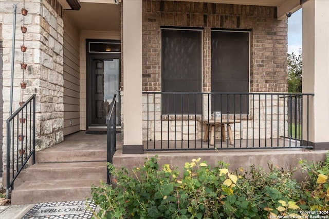 entrance to property with covered porch