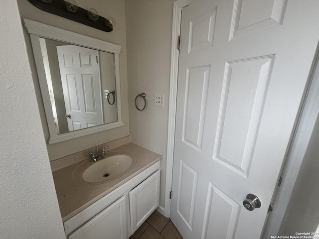 bathroom featuring tile patterned floors and vanity